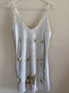 Free People Mini Dress with White and Gold Sequins. subtle white  lace hem